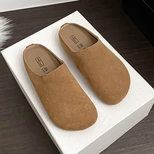 Minimalist light brown suede leather mule slipper with soft sole and round toe design