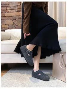 Dark grey felt Mary Jane mules with adjustable buckle strap and warm lining detail
