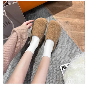 Top view of cozy brown teddy fleece closed-toe mules with fuzzy texture for autumn
