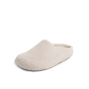 Plush beige faux lamb wool mule slippers with warm lining and non-slip rubber soles