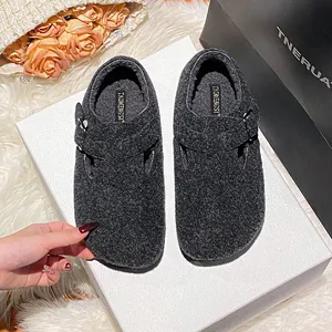Dark grey fleece lined clog slippers with adjustable buckle strap and plush interior