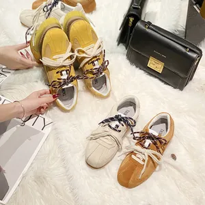 Women's multi-colored lace-up platform sneakers in suede and fabric on white fur rug