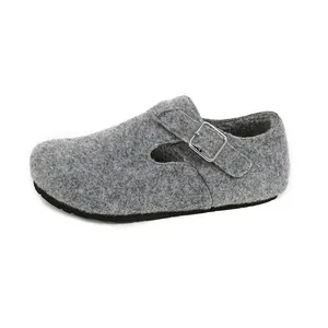 Grey felt platform clogs with warm fur lining and metal buckle adjustment