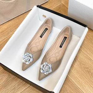 Khaki pointed-toe ballet flats featuring sparkling rhinestone camellia floral decoration