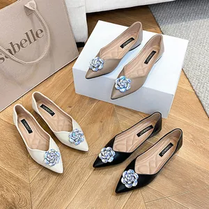 Elegant pointed-toe flat shoes for women with sparkling rhinestone flower embellishments