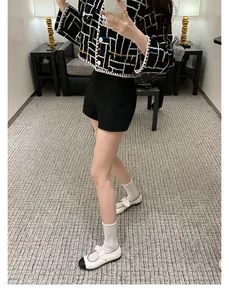 Full model view of Mary Jane shoes styled with a black tweed jacket and slim shorts
