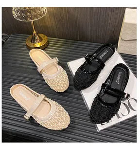 Detail of breathable mesh Mary Jane mule flats in beige and black with metal buckles