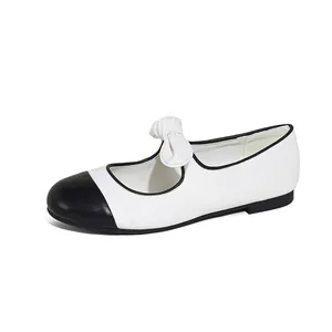 Bow-knot sheepskin Mary Jane flats with contrasting black round toe and white body