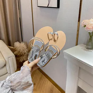 Sparkly rhinestone slide sandals for women with metallic silver finish and wedge sole