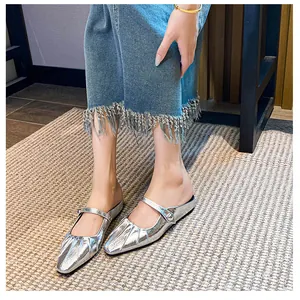 Detail of silver metallic square toe mule with pleated texture and Mary Jane strap