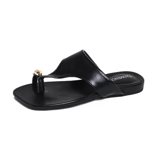 Chic black flat square toe thong sandals with gold buckle detail and flexible straps