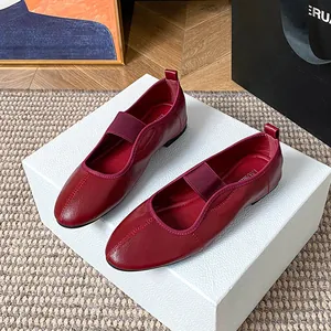 Classic deep red round toe Mary Jane flats with elastic straps and premium leather texture