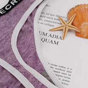 Close-up of purple ribbed texture underwear with ECR logo elastic band and white piping