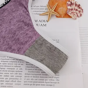Detail view of purple marled fabric with grey panels and white ribbed trim on panties