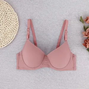 Detail view of pink gathered bra featuring soft ribbed texture and adjustable straps