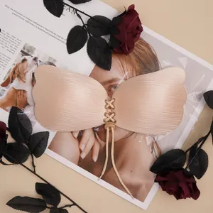Detailed view of beige adhesive wing-shaped bra with adjustable drawstring drawstring design