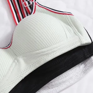 Detail of ribbed fabric bras in mint, black and white with striped adjustable straps