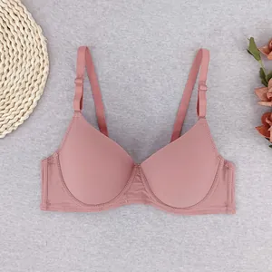 Pink ribbed push-up bra for women featuring adjustable straps and minimalist textured design