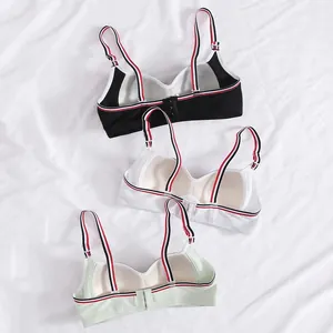 Three-piece seamless wireless bra set in black white and green with stylish tricolor straps