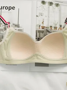 Detail of light green bra showing breathable honeycomb mesh cups and striped shoulder straps