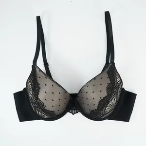 Detail of black lace push-up bra featuring delicate floral embroidery and polka dot mesh
