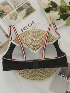Detail of black wireless sports bra with striped elastic band and breathable mesh back