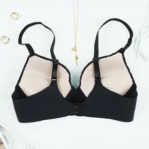 Seamless black push-up bra with inner cup structure and adjustable straps shown on back
