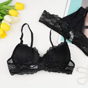 Elegant black lace lingerie set with underwire bra and matching thong on a white background