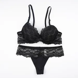 Elegant black lace lingerie set with wired push-up bra and matching thong on white back