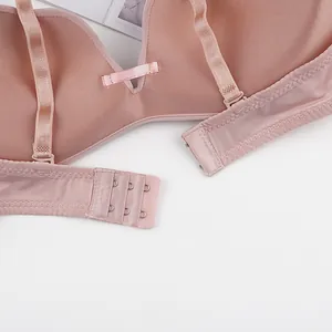 Close-up of adjustable straps and seamless three-hook back closure on lotus pink bra