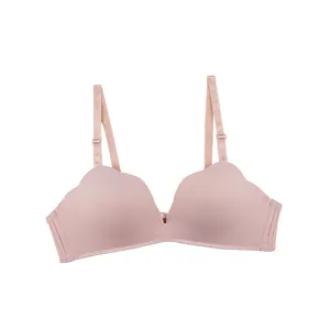 Pink wireless seamless bra with scalloped edges and adjustable straps on white background