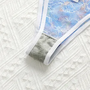 Close-up of breathable cotton crotch and light blue floral lace detailing on panties