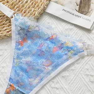 Detailed macro shot of blue lace thong featuring colorful butterfly prints and metal buckles