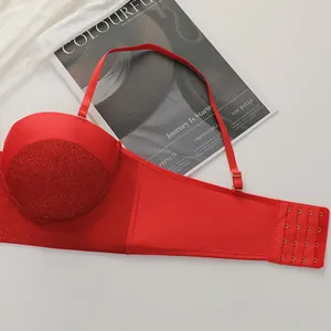 Close-up of red push-up bra featuring shimmering sequin cups and four-row hook-and-eye closure