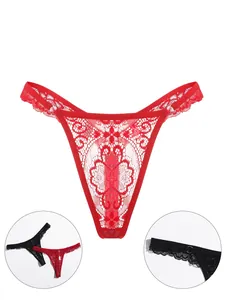Detail shot of red lace G-string showing intricate mesh patterns and metal ring connectors