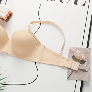 Detailed view of nude lace bra with adjustable straps and triple row hook back closure