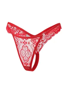 Detailed close-up of bright red floral lace thong with metallic ring design