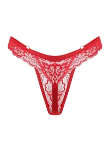 Detailed close-up of vibrant red lace thong with metal ring accents and floral patterns