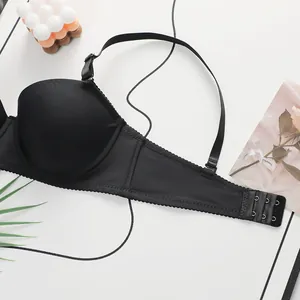 Detailed back view of black lace bra featuring adjustable straps and three-row hook closure