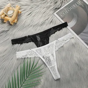 Detailed lace texture of black and white T-back thongs with adjustable metal rings