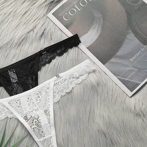 Close-up of lace thongs with metal rings on soft faux fur background and magazine