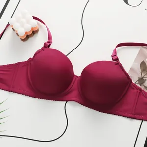 Detail view of smooth wine red lace bra with seamless 3/4 cups and wide side support