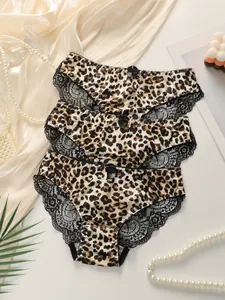 Three-pack leopard print satin panties with delicate black lace trim and small bow detail