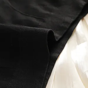 Close-up of the seamless high-elastic knitted fabric with fine texture on black camisole