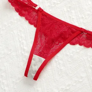 Macro detail of red floral lace T-back with cotton crotch and silver metal ring accents