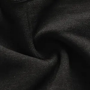 Close-up of black seamless ribbed fabric texture for women's spaghetti strap camisole