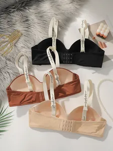 Trois soutiens-gorge push-up sans couture noirs, marron et beige avec bretelles florales
