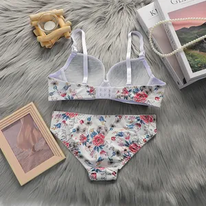 Flat lay detail of floral lace lingerie set featuring adjustable straps on soft plush