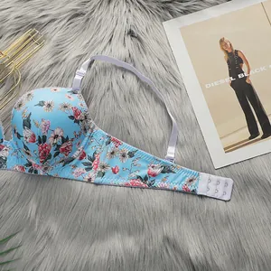 Floral print underwire bra with lavender straps on a textured grey background