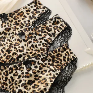 Leopard print women's panties with black lace trim and bow accent in a multi-pack set